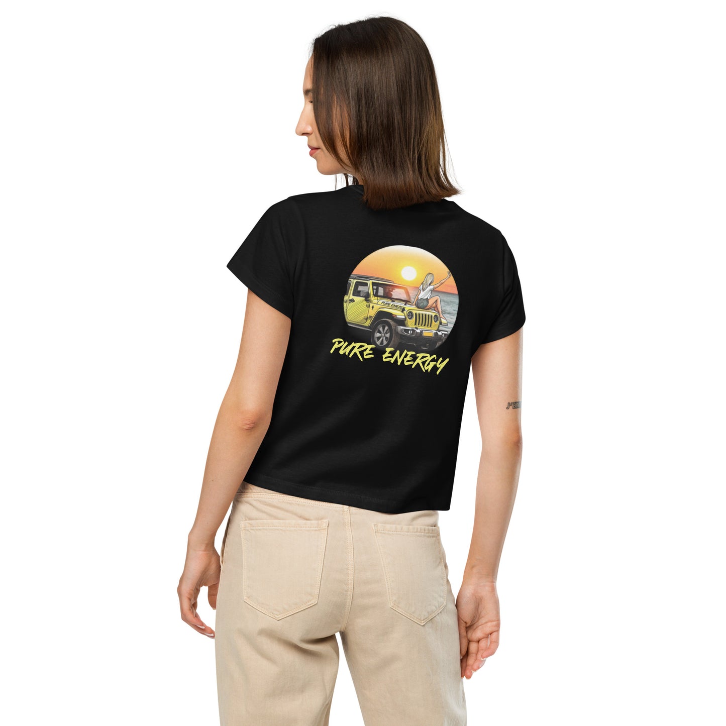 a woman wearing a black t - shirt with a yellow bus on it