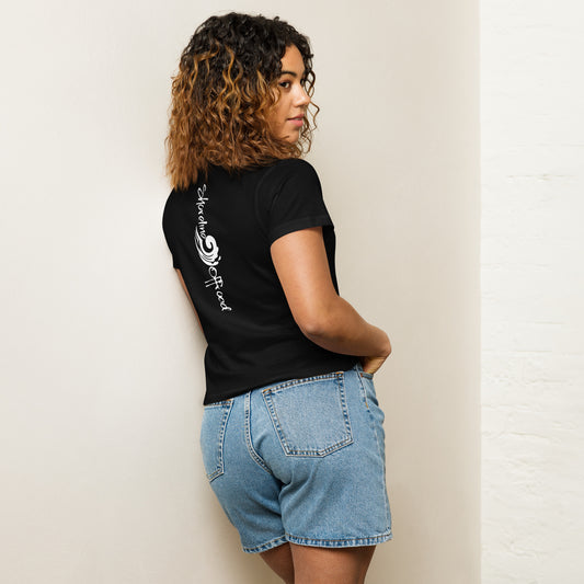 a woman leaning against a wall with her back to the wall