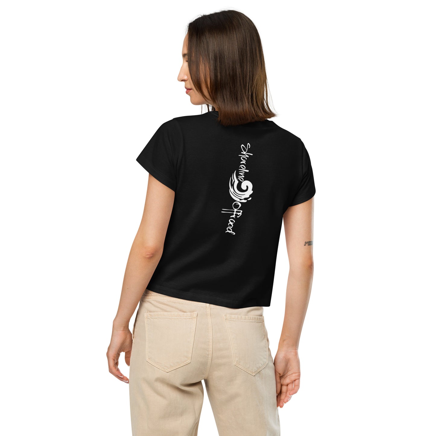 a woman wearing a black t - shirt with a musical note on it