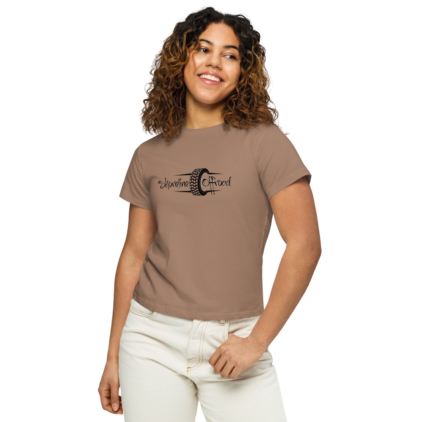 a woman wearing a brown shirt and white pants