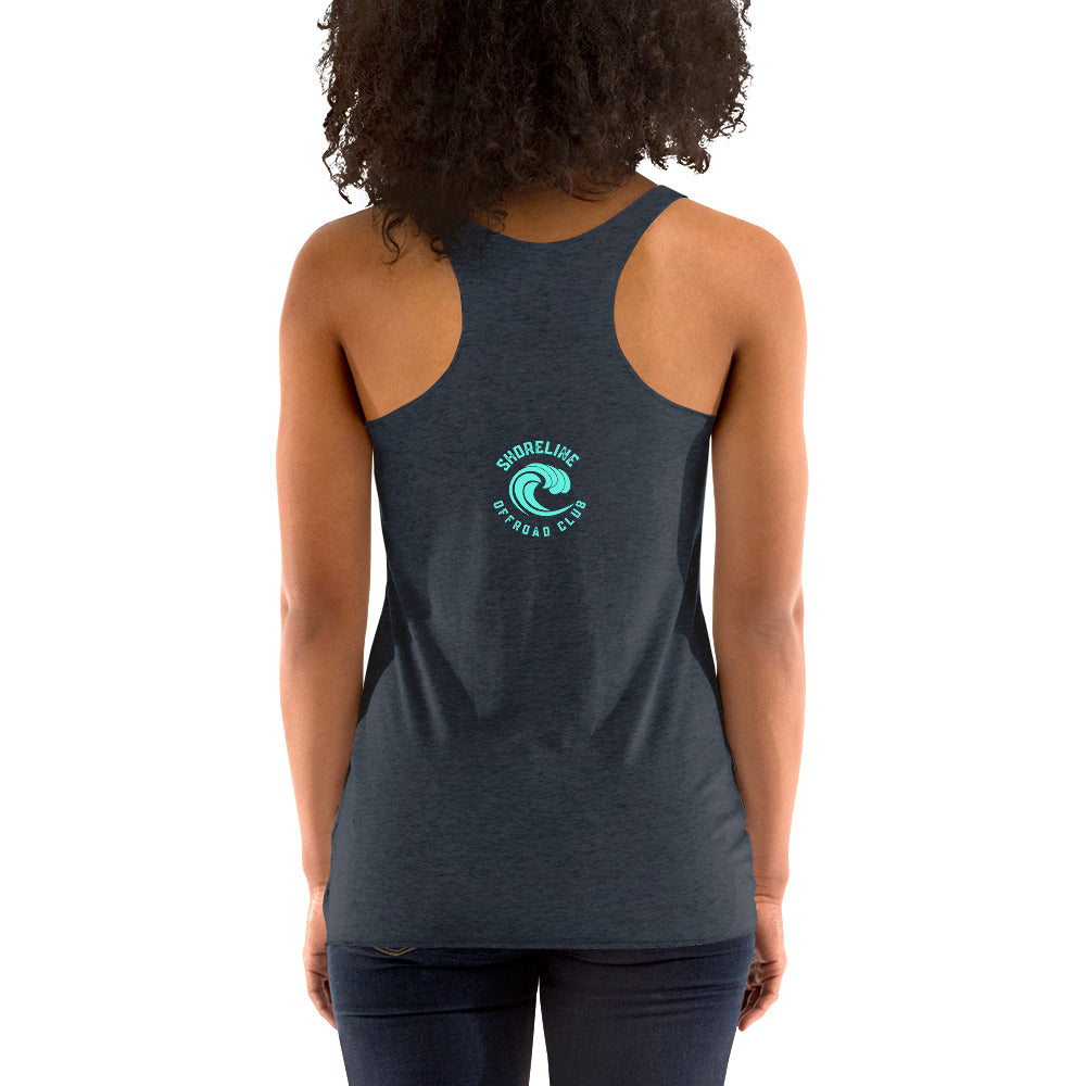 a woman wearing a dark tank top with a green logo