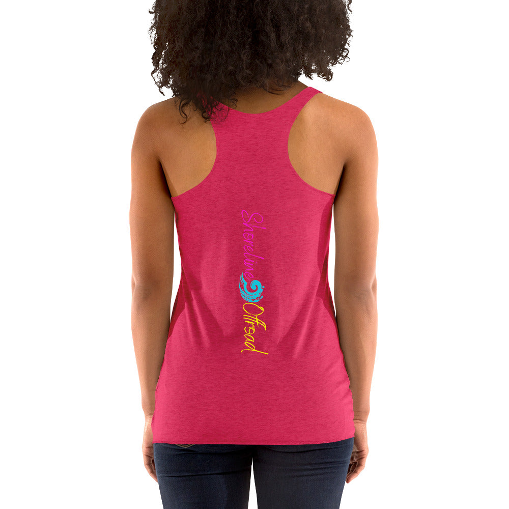 a woman wearing a pink tank top with a colorful design
