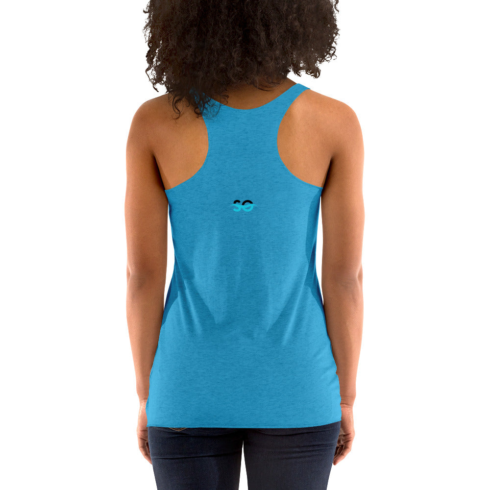a woman wearing a blue tank top with a smiley face