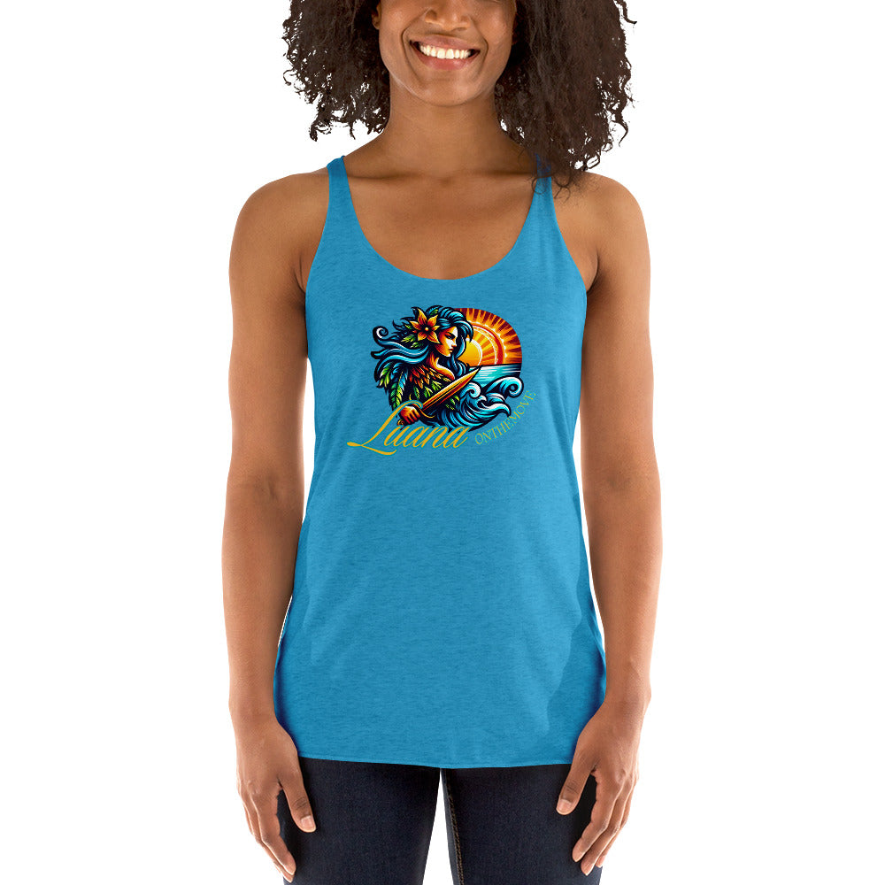 a woman wearing a blue tank top with a colorful fish on it