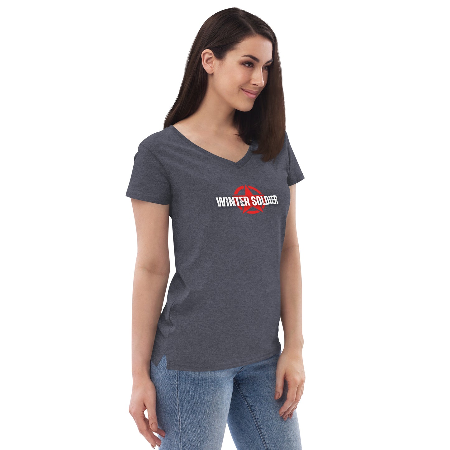 a woman wearing a grey shirt and jeans