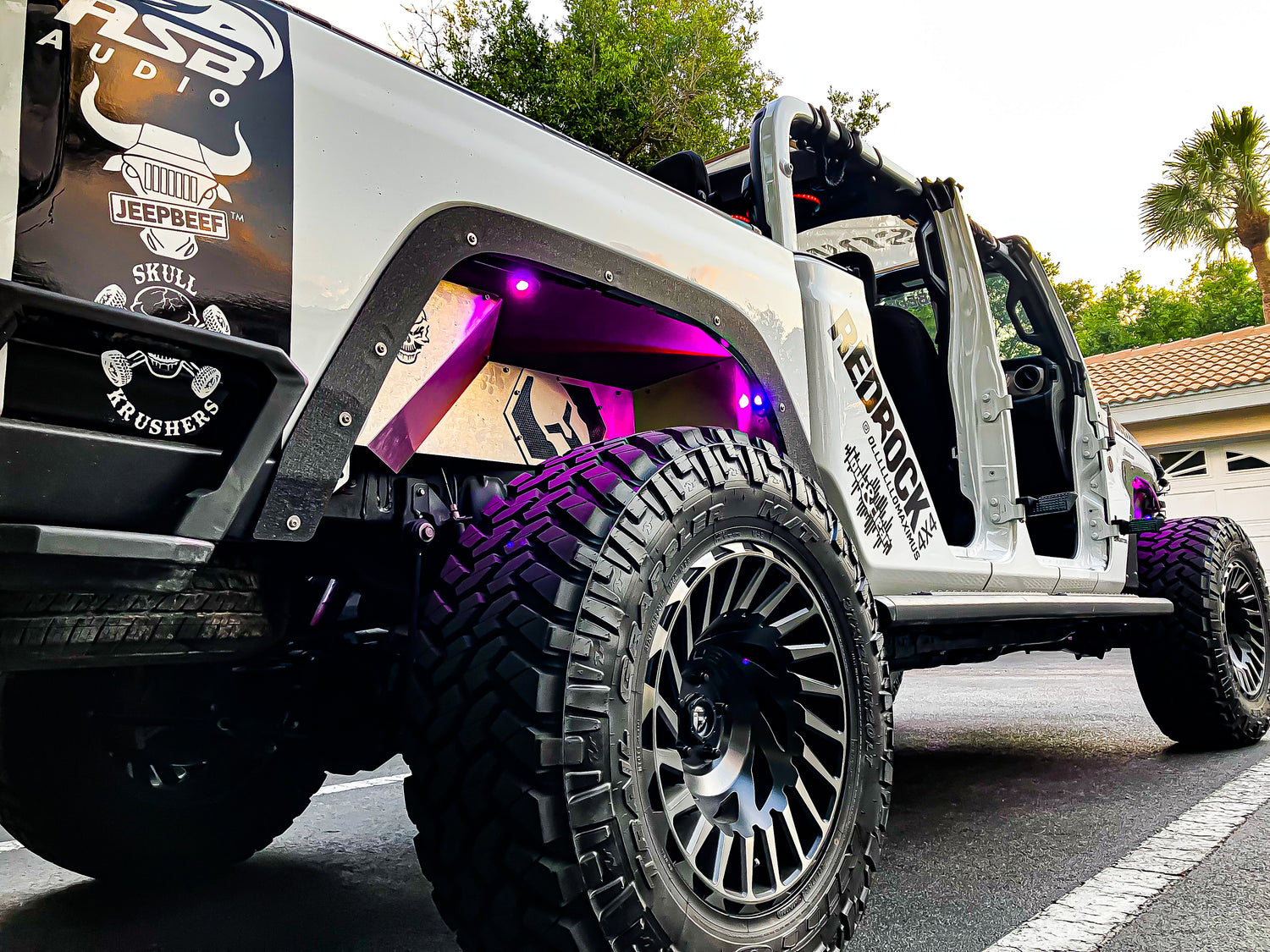 a white truck with a purple light on it's side