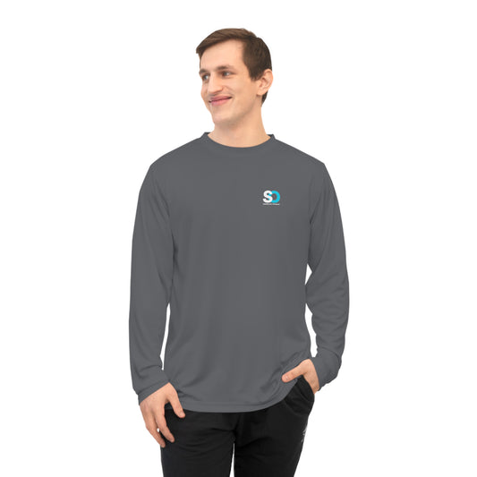 a man wearing a gray long sleeve shirt with a blue and white logo on the