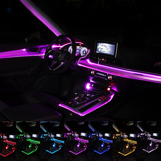 the interior of a car is lit up with colorful lights