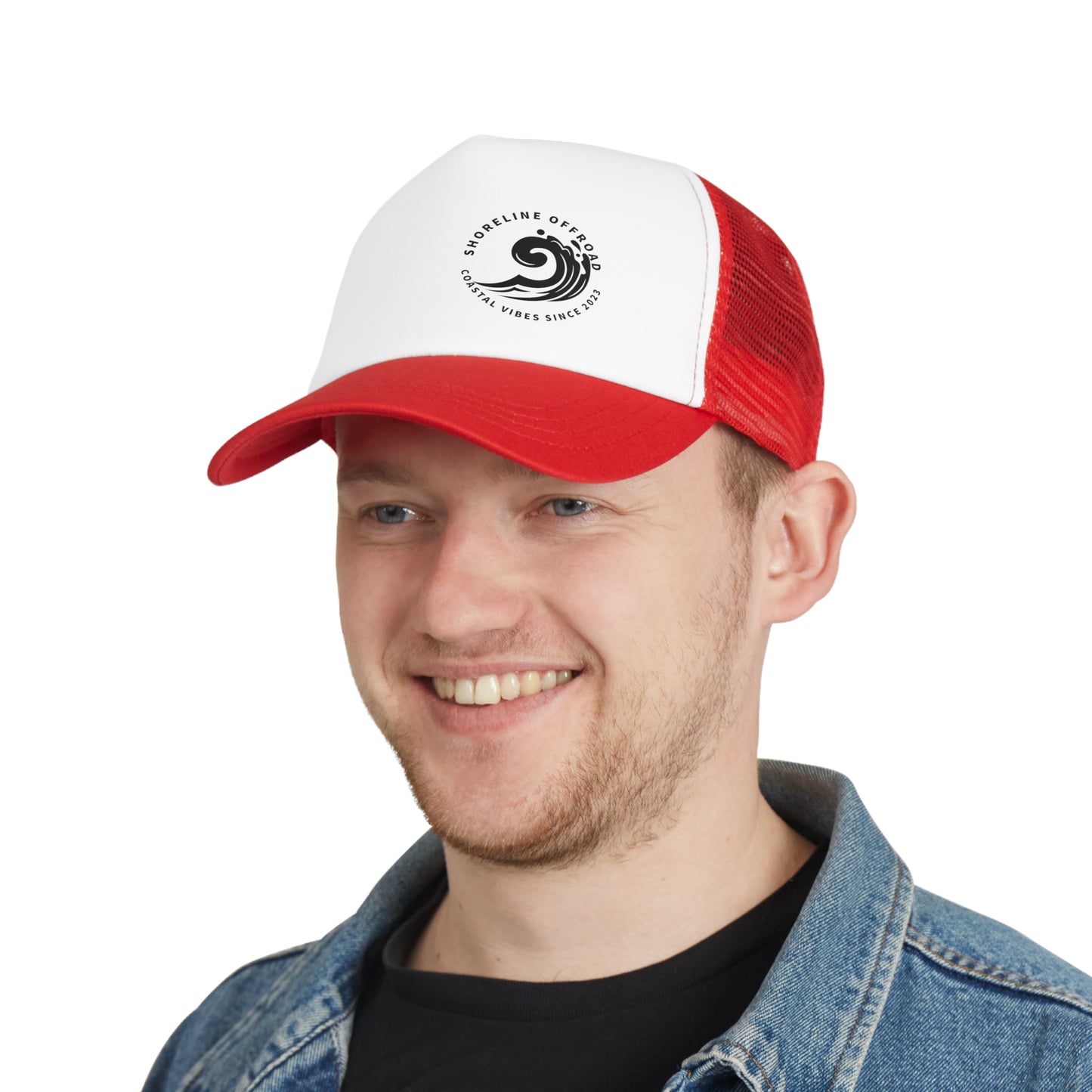 a man wearing a red and white trucker hat