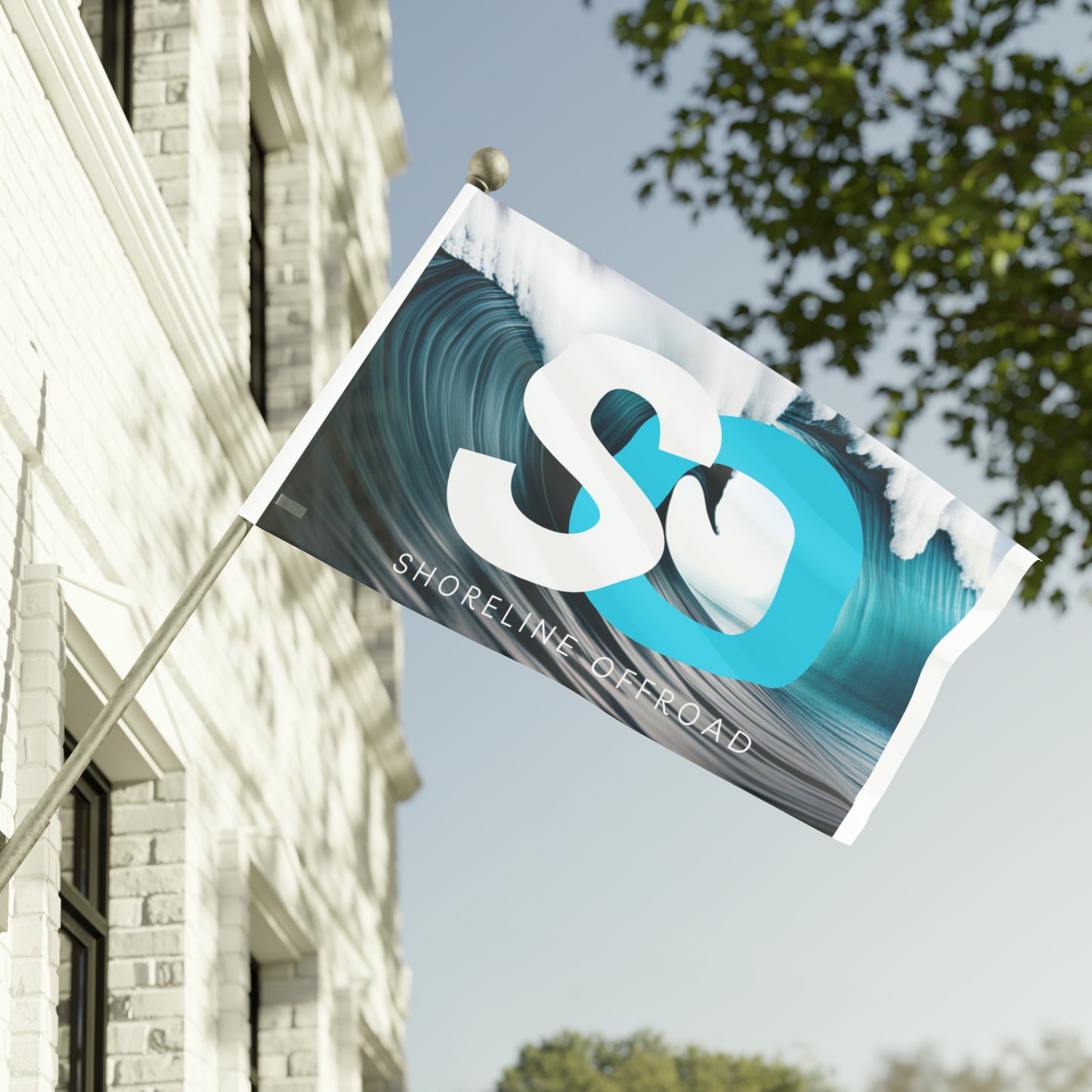 a white building with a blue and white banner hanging from it's side