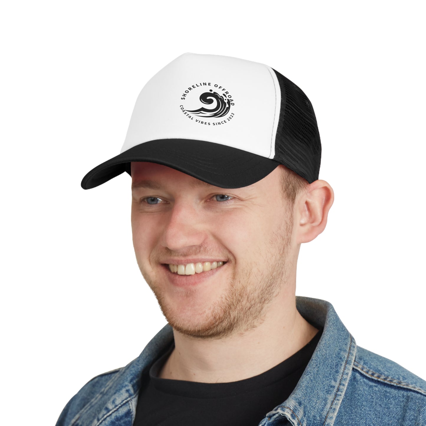 a man wearing a black and white trucker hat