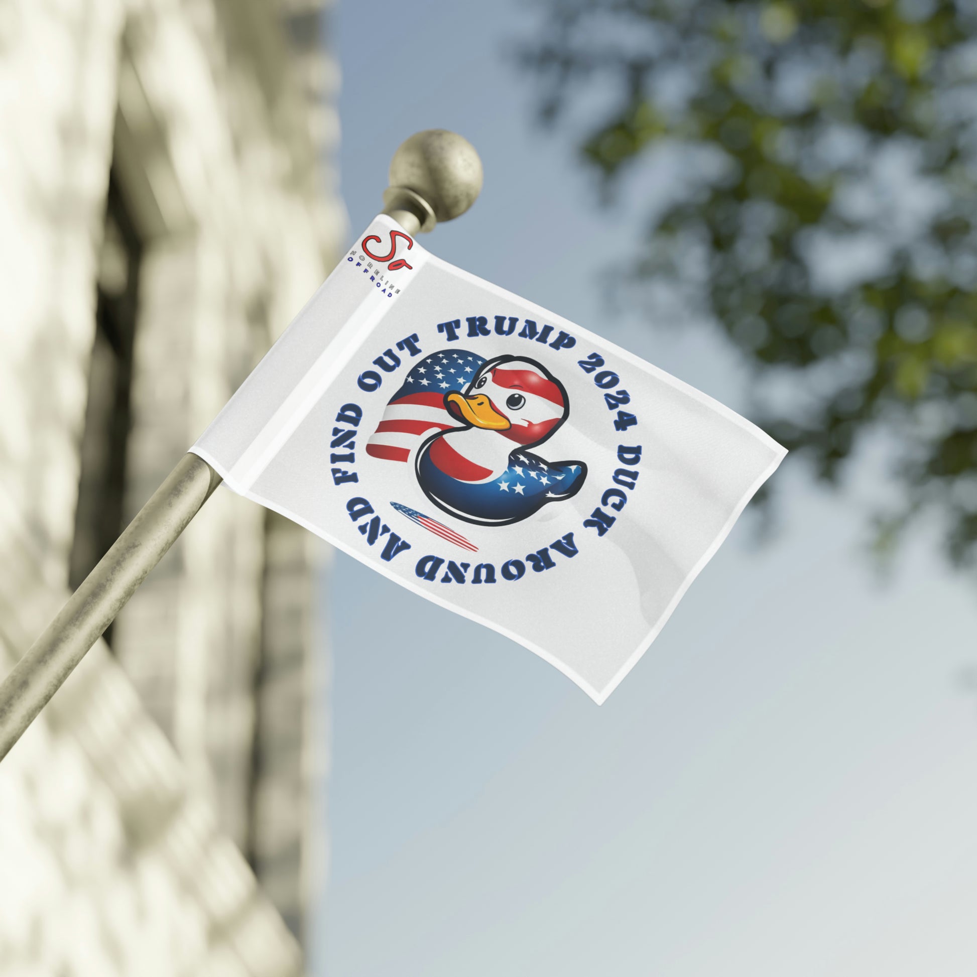 a flag with a bird on it is hanging from a pole