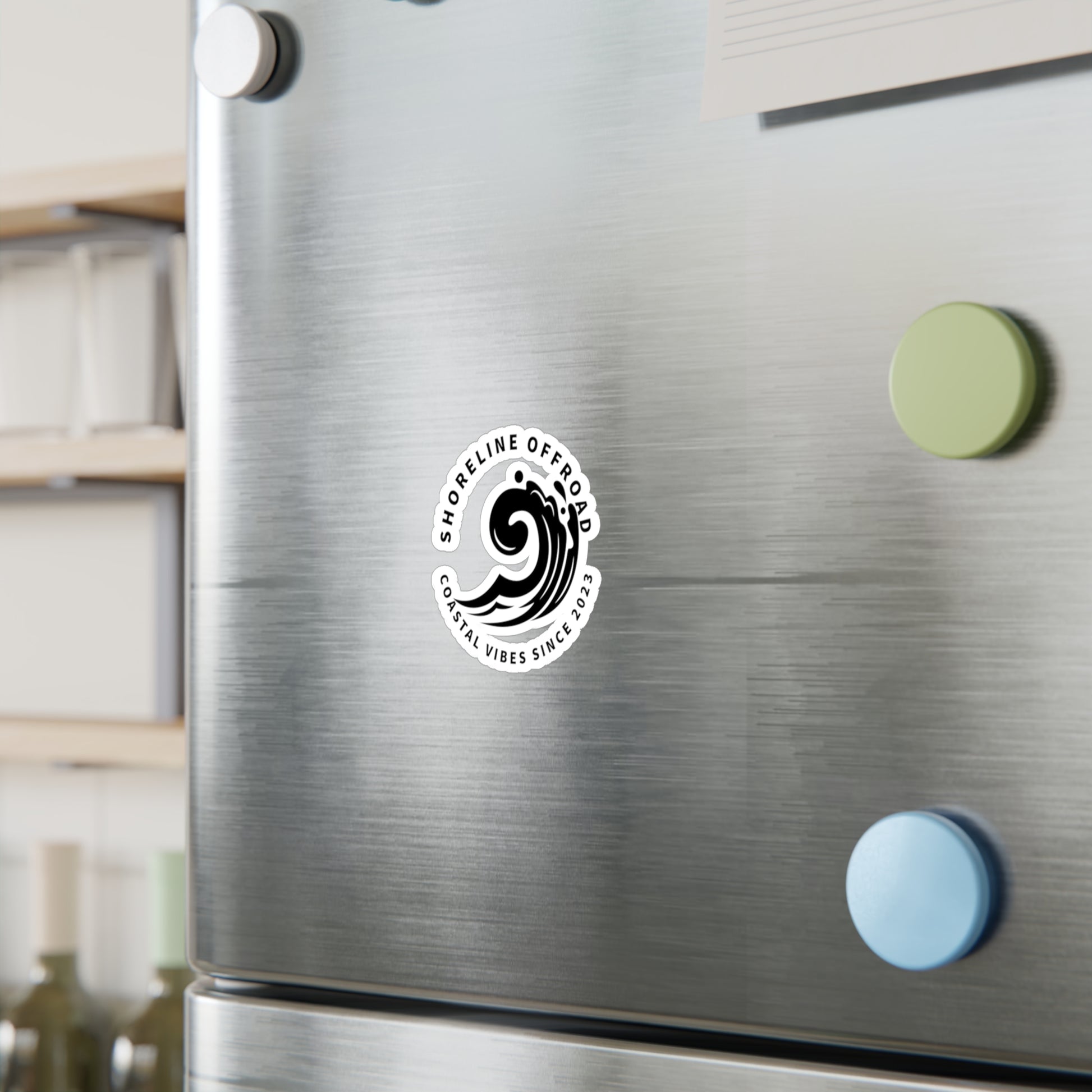 a stainless steel refrigerator with a sticker on it