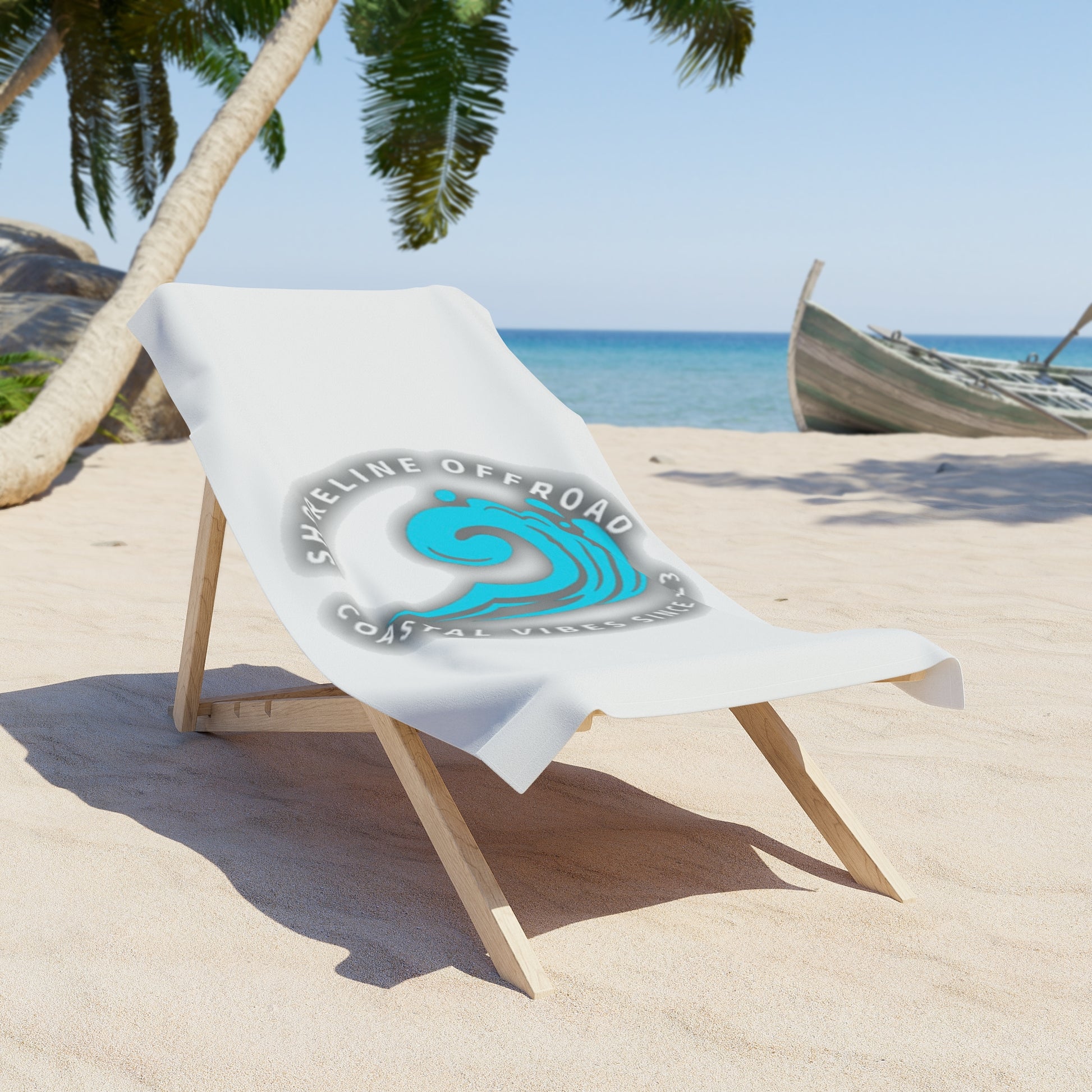 a white beach chair sitting on top of a sandy beach