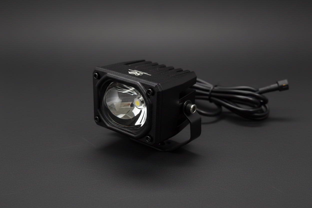 Nighttime performance of Shoreline Offroad Pro Series 2.5” RGB Driving Light Pod Lights illuminating a dark trail.