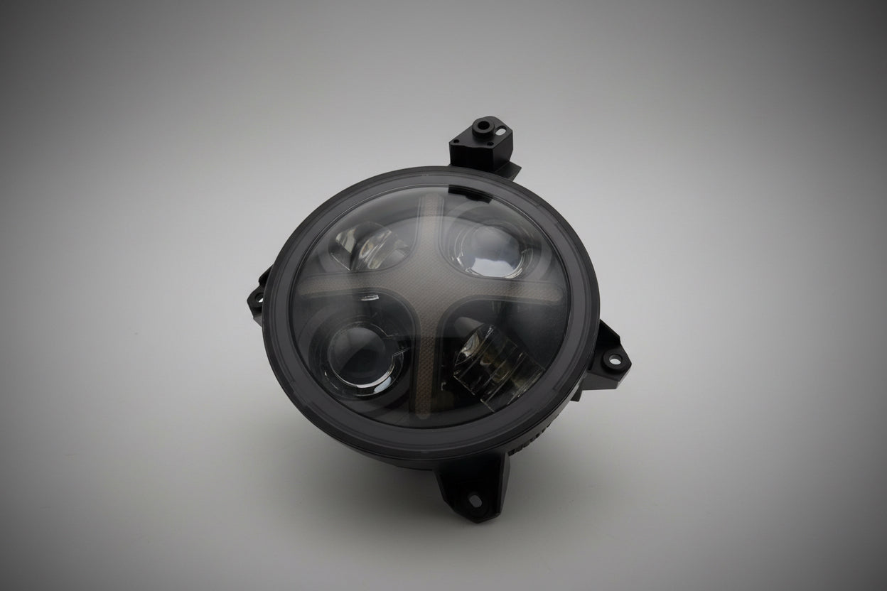 Close-up view of Shoreline Offroad Pro Series LED 9” JL JT RGB X Series Headlights highlighting the durable die-cast aluminum housing and vibrant RGB colors.