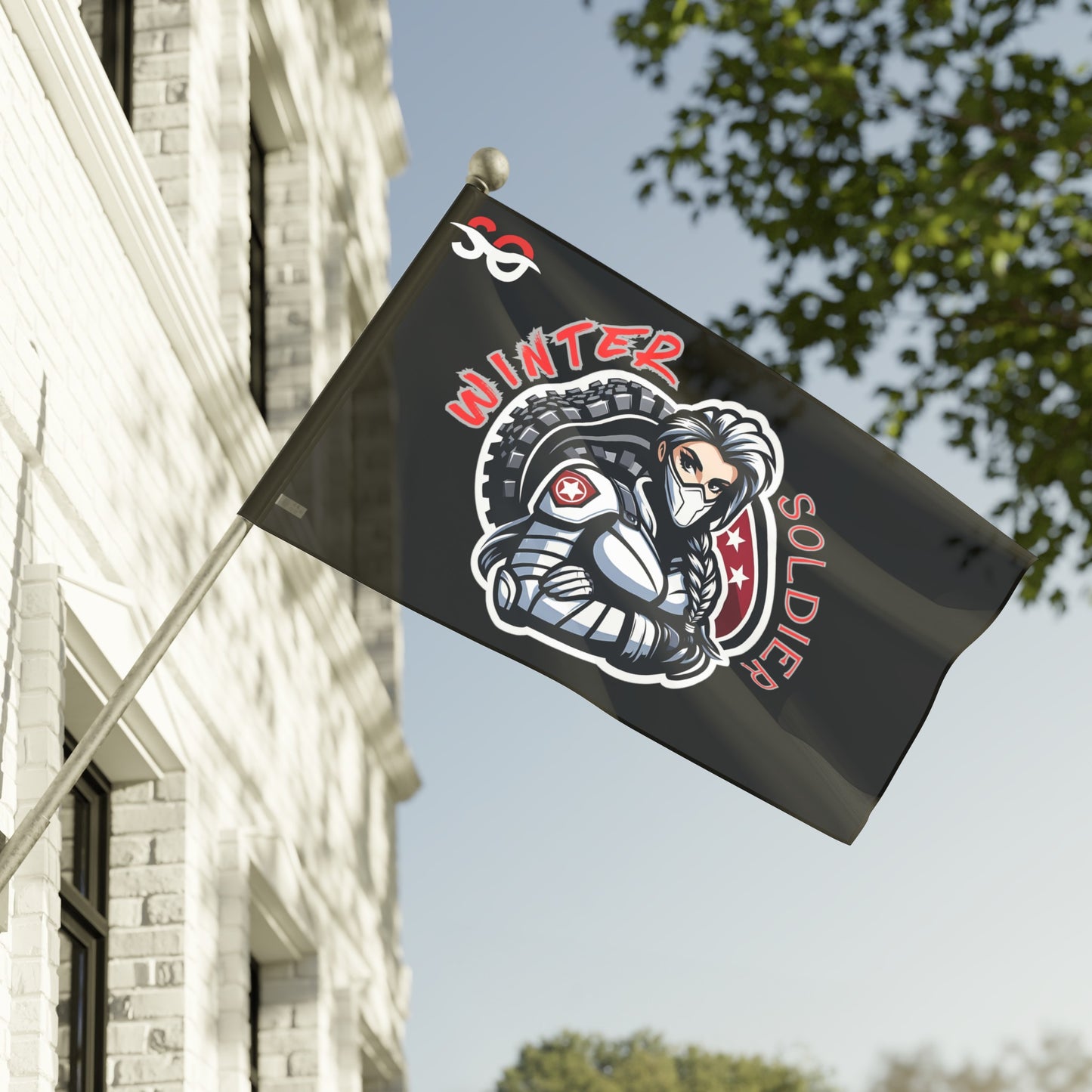 a black and red flag hanging from the side of a building