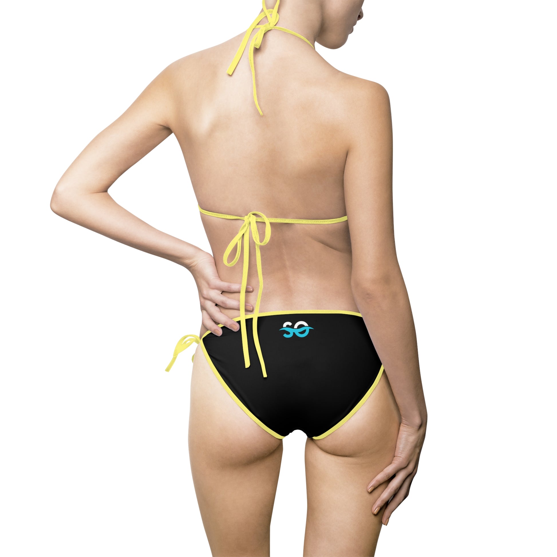 a woman in a black and yellow bikini bottom