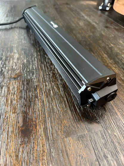 Shoreline Offroad Pro Series 20” RGBIC Lightbar illuminating a dark trail, showcasing intense brightness and vibrant RGB colors, perfect for off-roading adventures.