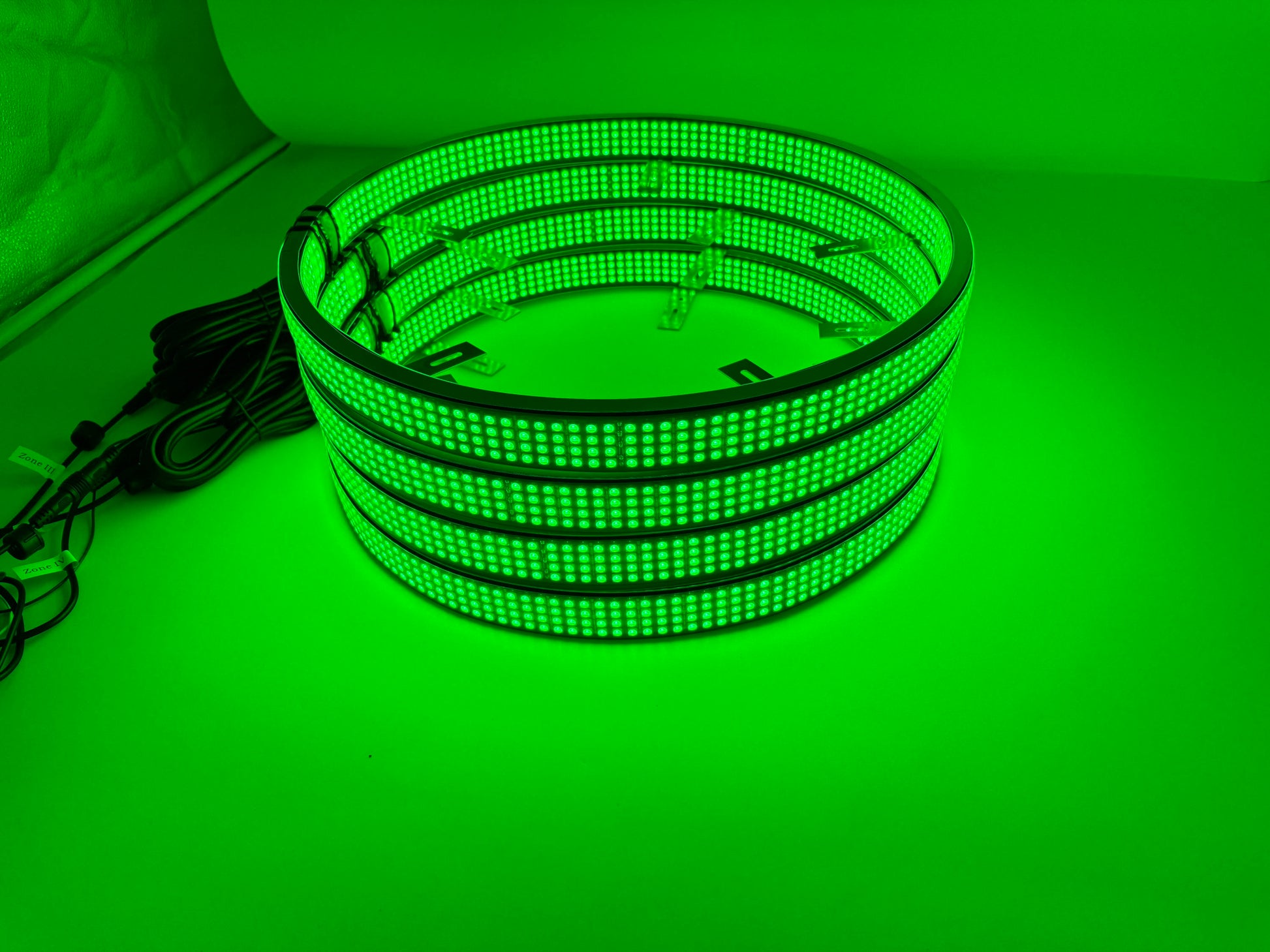 a stack of green lights sitting on top of a table