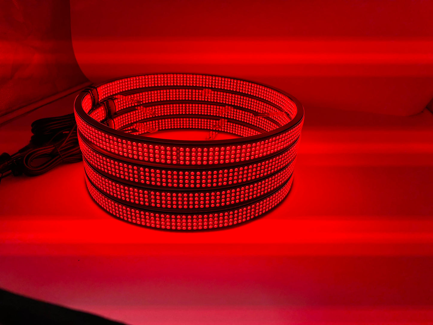 a close up of a red light in a room