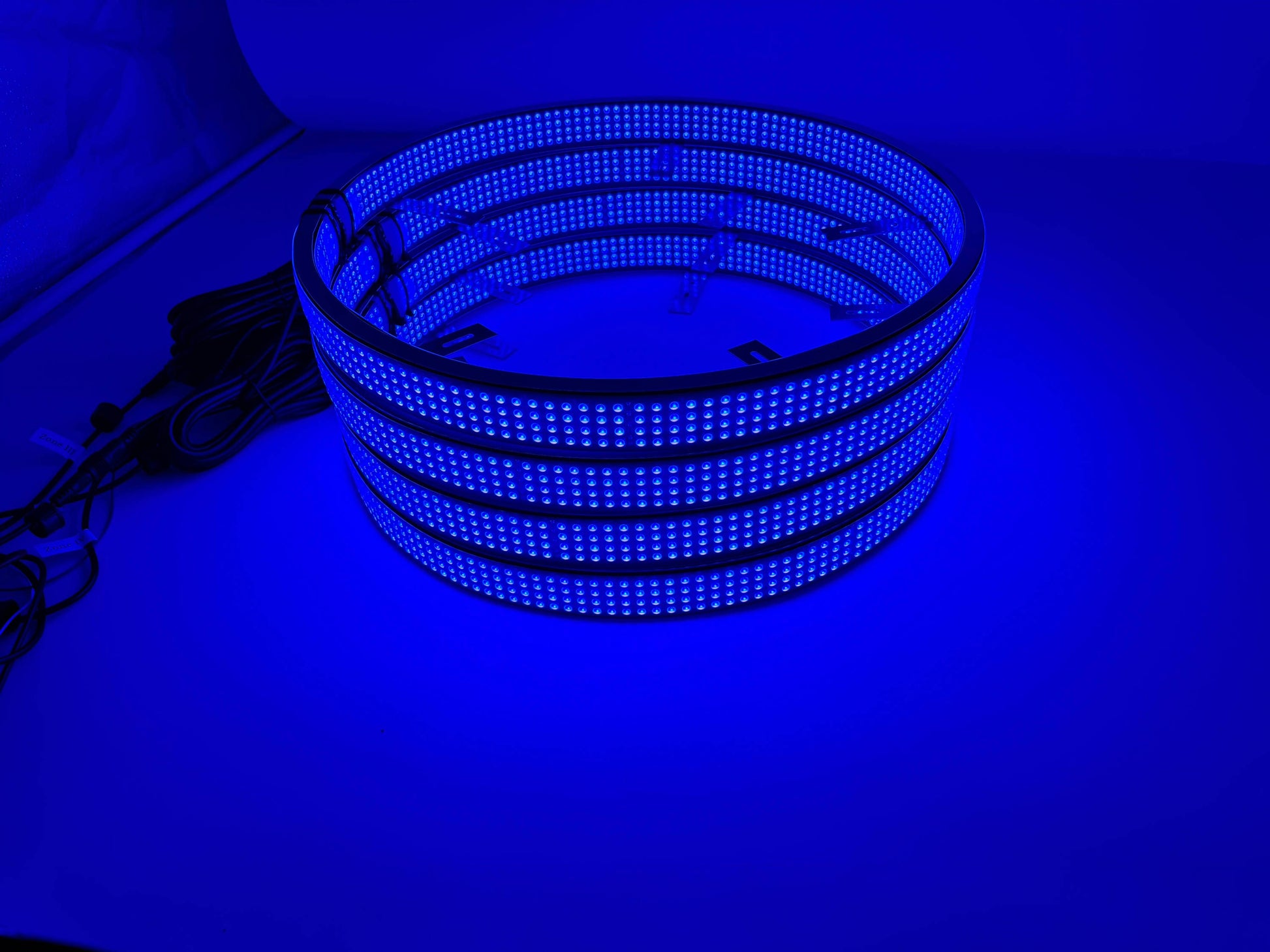 a stack of blue lights sitting on top of a table