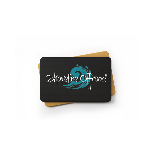a black and blue coaster with the words explore the shore on it