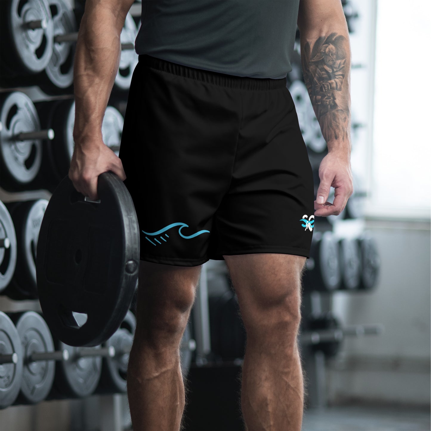 a man holding a barbell in a gym