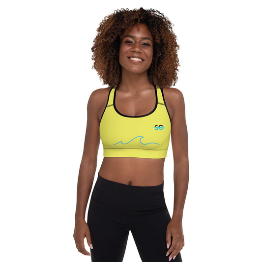 a woman in a yellow sports bra top