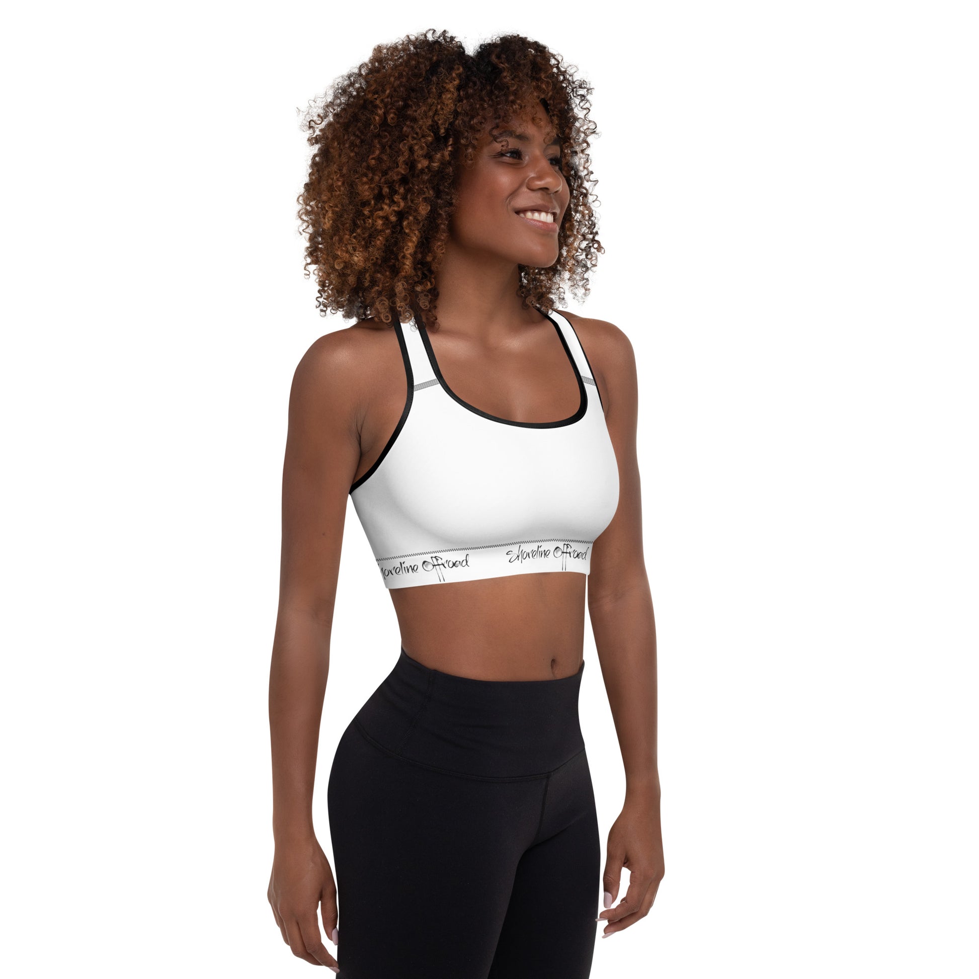 a woman in a white sports bra top and black leggings