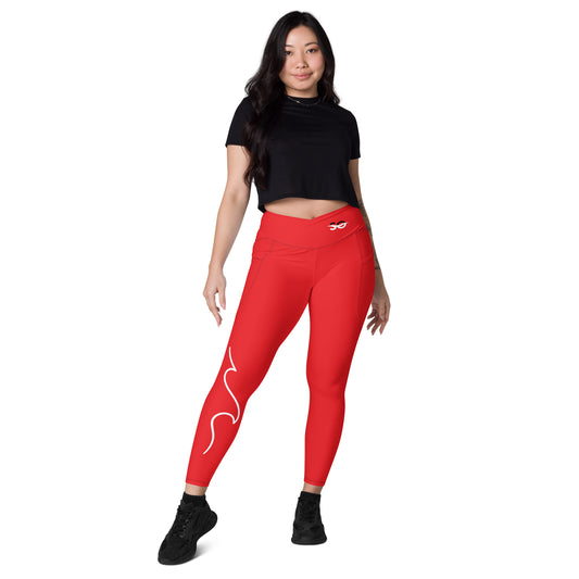 a woman in a black top and red leggings