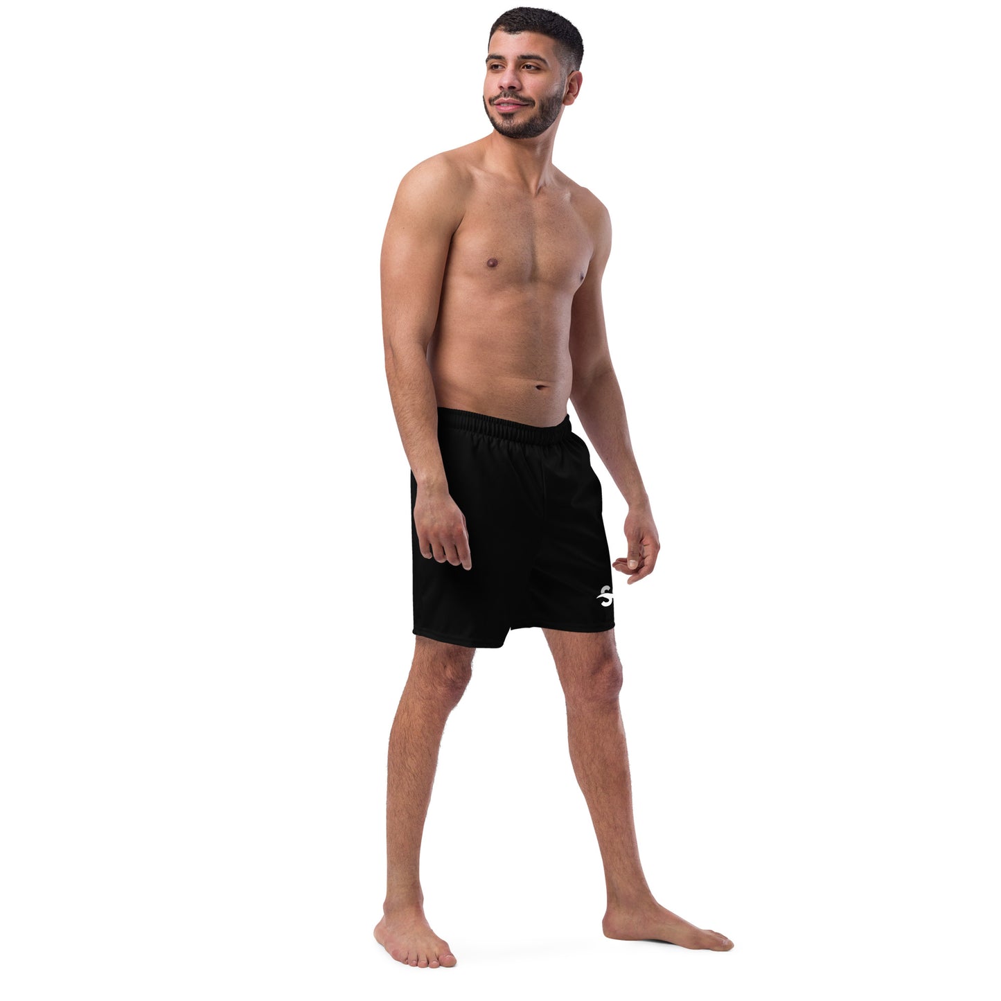 a man with no shirt standing in a black shorts