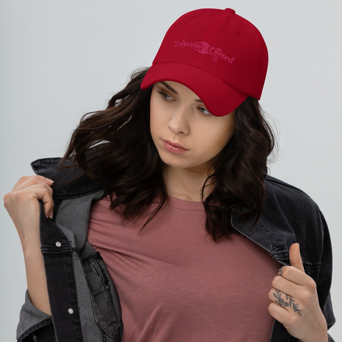 a woman wearing a red hat and jacket