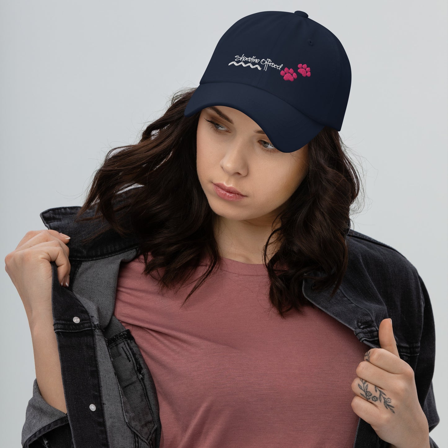 a woman wearing a hat with flowers on it