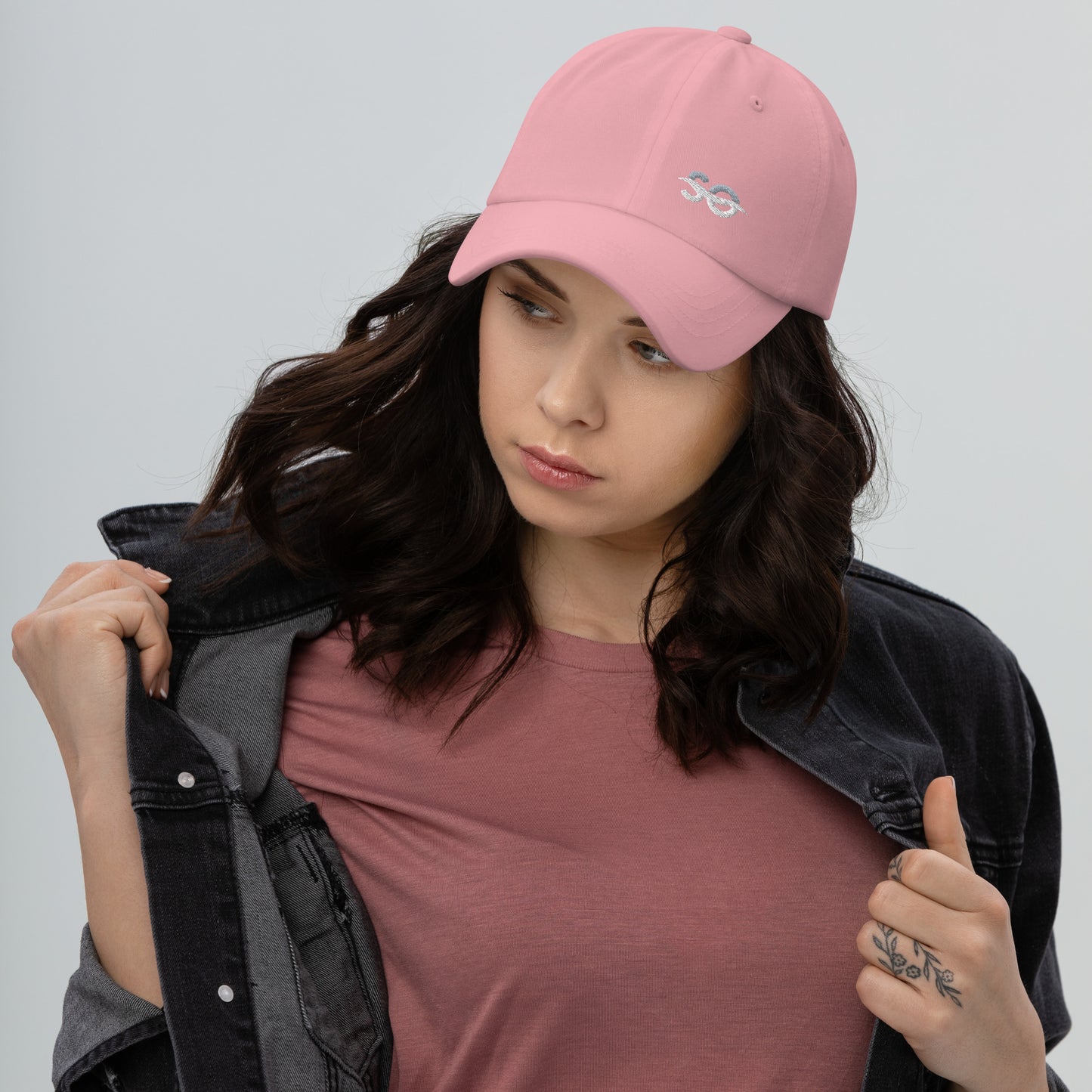 a woman wearing a pink hat and jacket