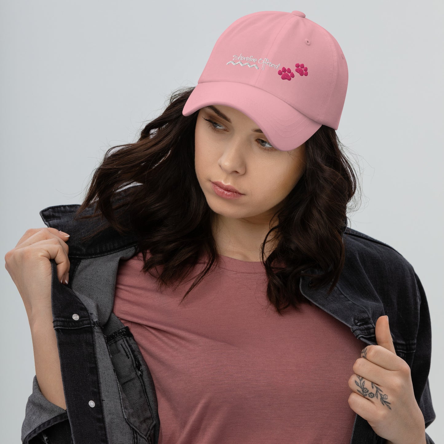 a woman wearing a pink hat and jacket