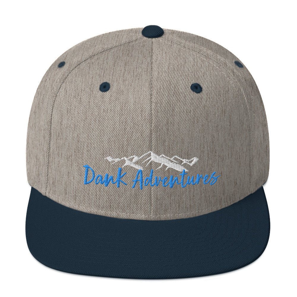 a gray and blue hat with the words dark adventures on it