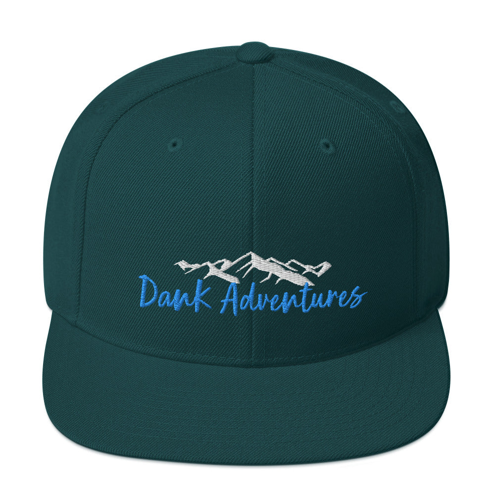 a green hat with the words dark adventures on it