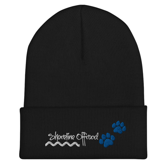 a black beanie with a blue paw on it