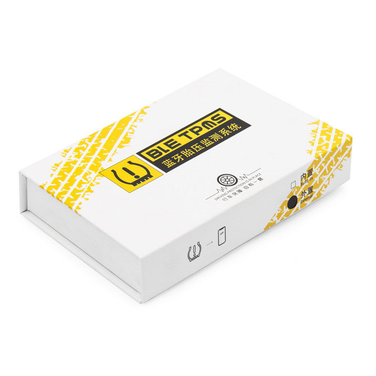 a white box with a yellow and black sticker on it