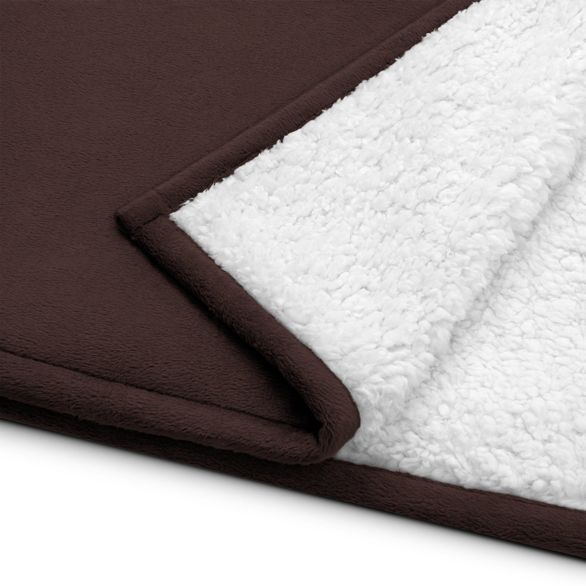 a close up of a blanket on a white surface