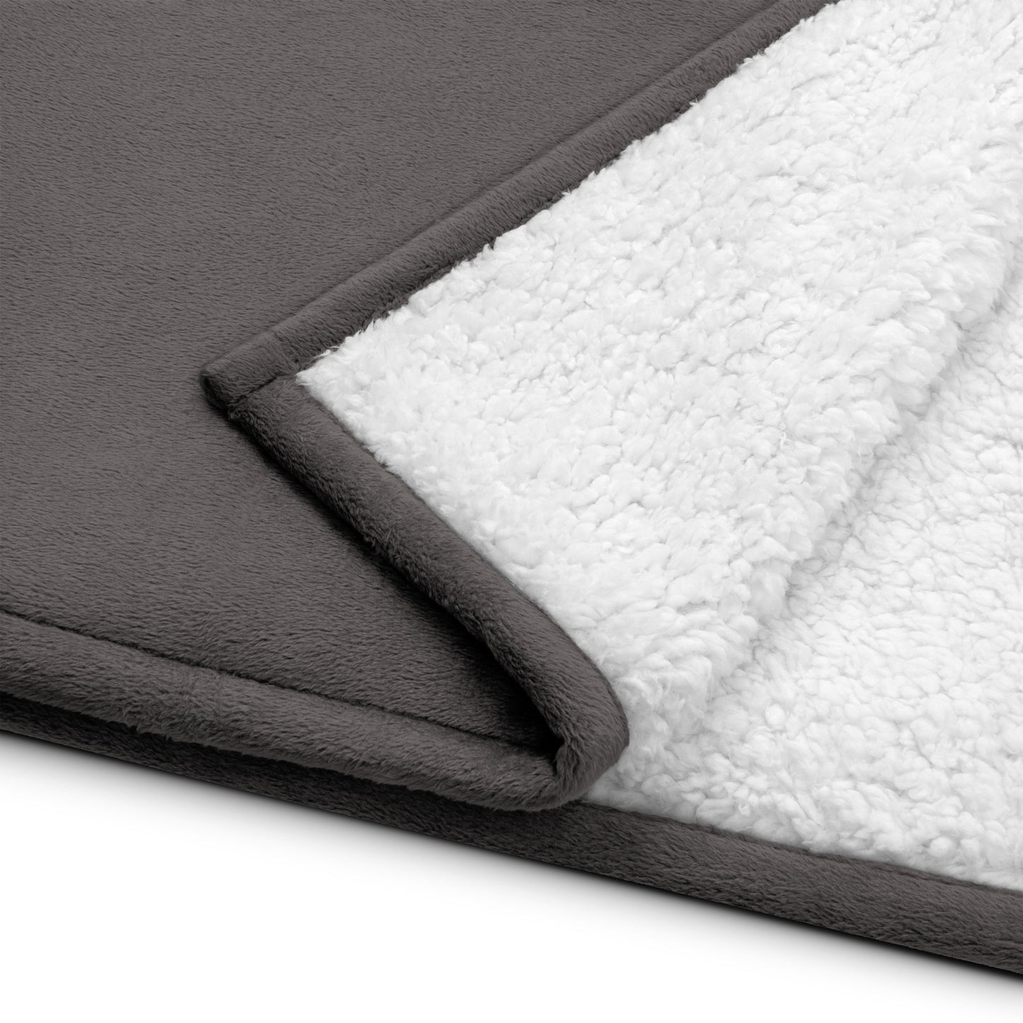 a close up of a blanket on a white surface