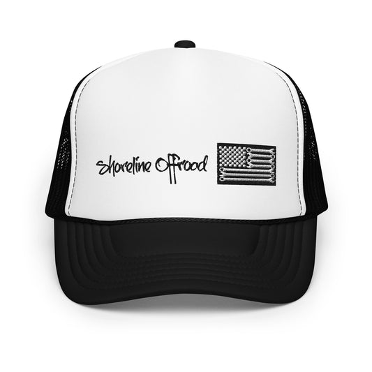 a white and black trucker hat with a black and white flag