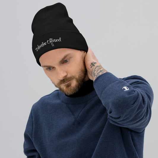 a man with a beard wearing a beanie