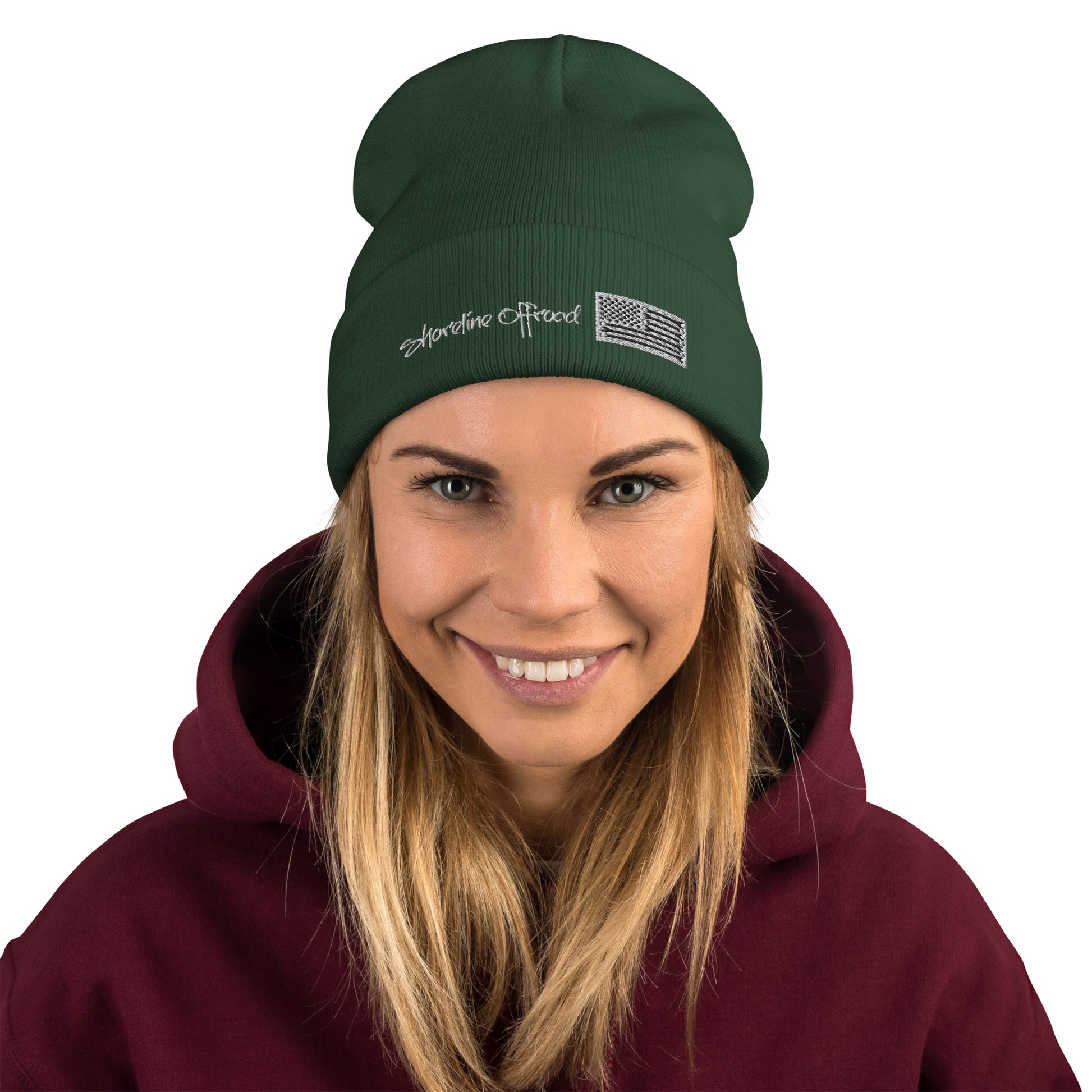 a woman wearing a green beanie hat