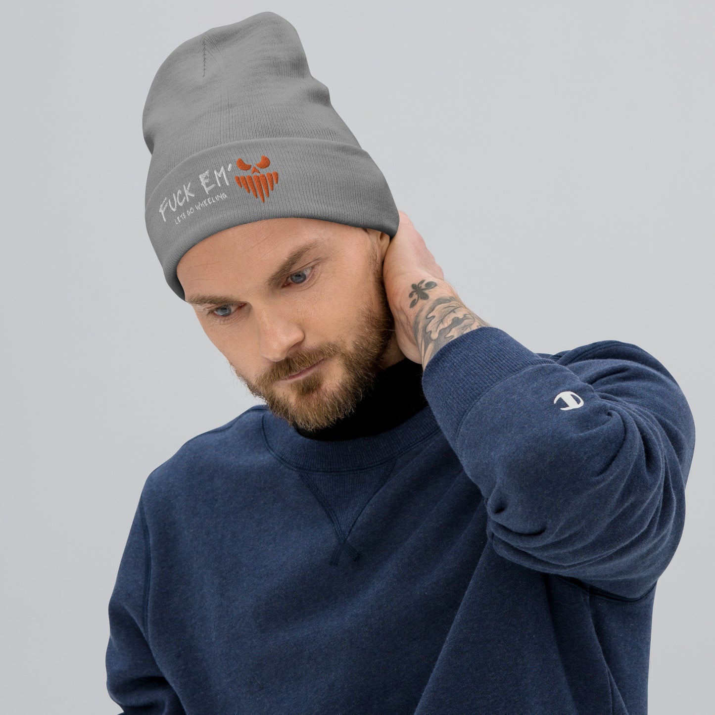 a man with a beard wearing a beanie