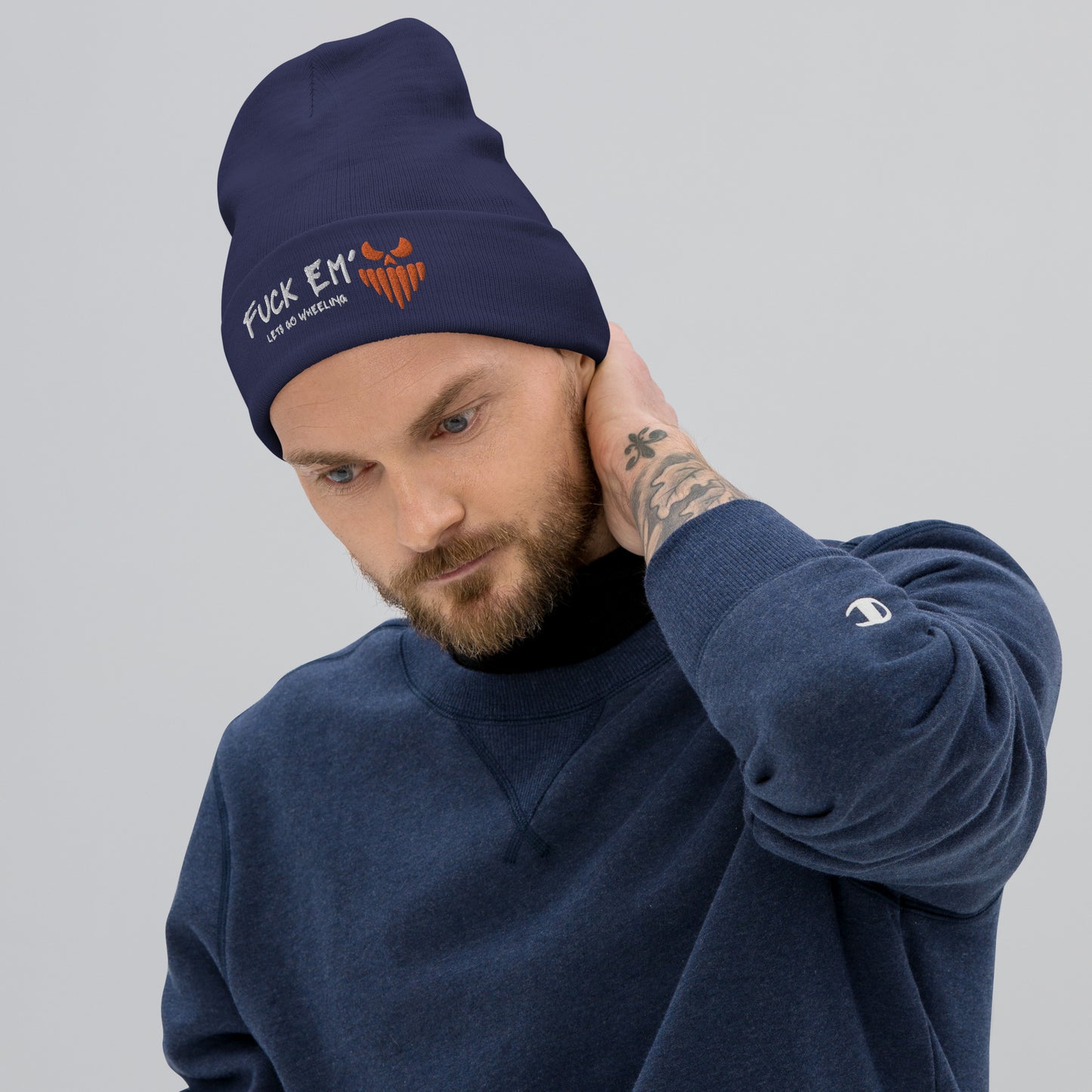 a man with a beard wearing a beanie