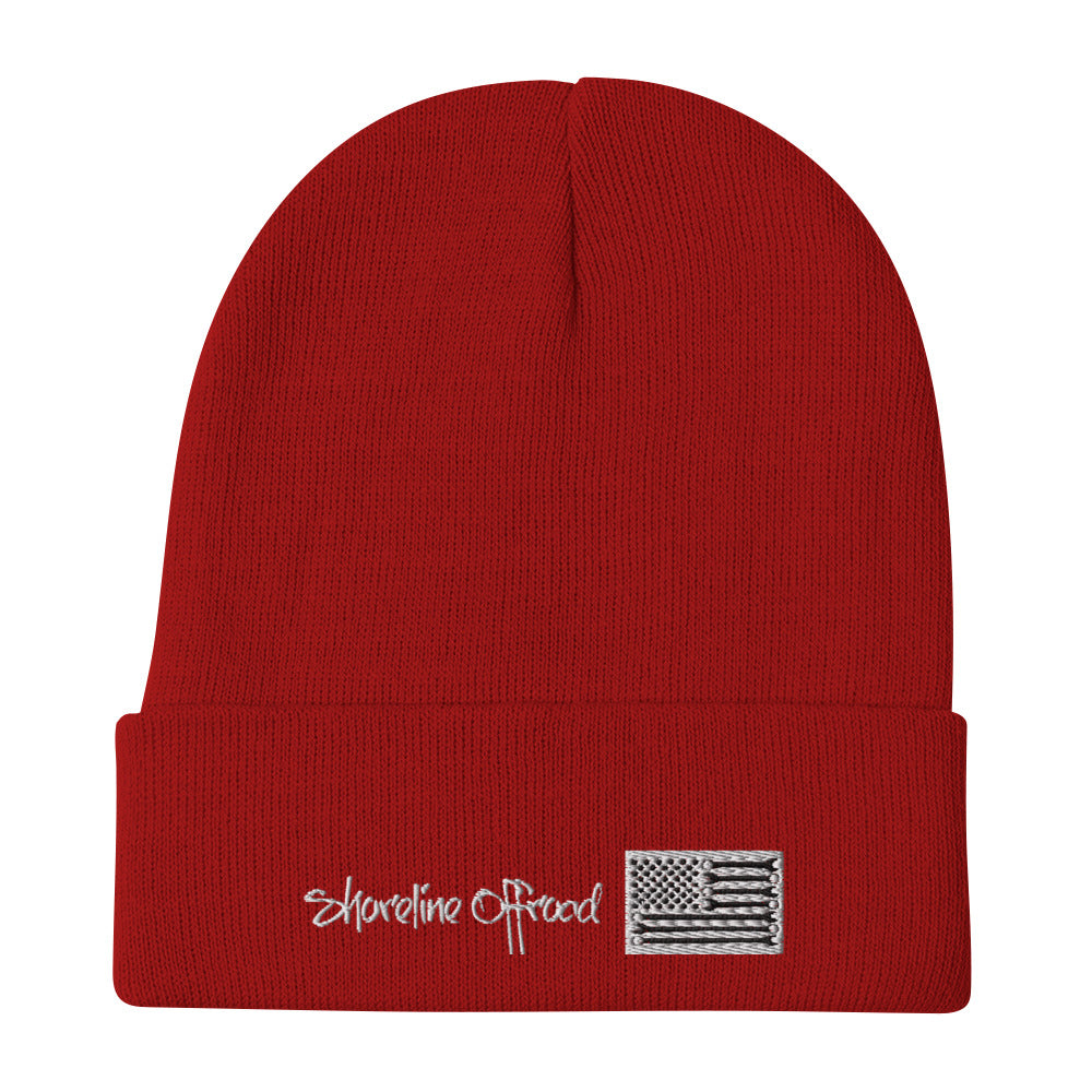 a red hat with a flag and the words shoreline creek on it