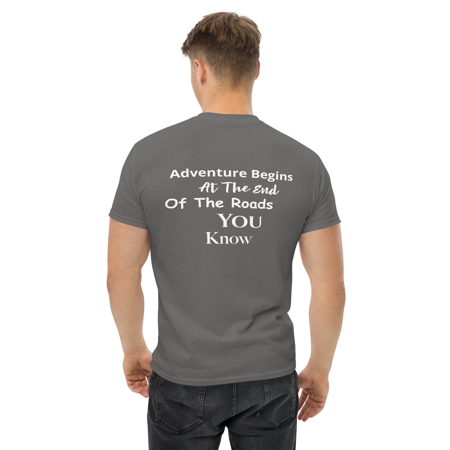 a man wearing a t - shirt that says adventure begins at the end of the