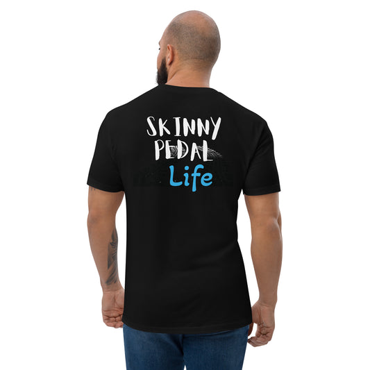 a man wearing a black t - shirt that says ski tiny pedal life